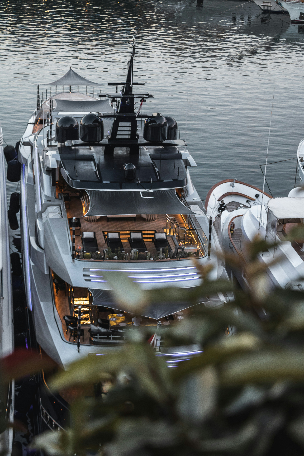 Aerial view of a luxury superyacht at dusk